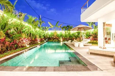 a swimming pool in the backyard of a villa at Exquisite 4Bd Gem, 5min to Finns Coastal Vibe in Canggu