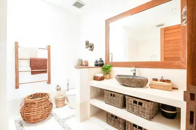 a bathroom with a sink and a mirror at Exquisite 4Bd Gem, 5min to Finns Coastal Vibe in Canggu