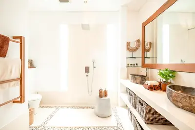 a bathroom with a sink and a mirror at Exquisite 4Bd Gem, 5min to Finns Coastal Vibe in Canggu