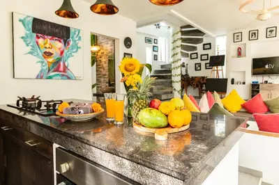 a kitchen counter with a bowl of fruit on it at PROMO Modern Seminyak Pvt Villa with Pool and Parking in Seminyak