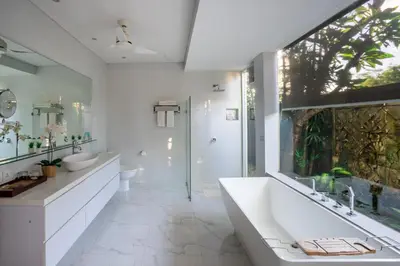 a bathroom with two sinks and a tub and a shower at Lacasa3 Villa Legian With Butler in Legian