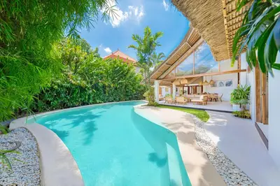 an infinity pool in the backyard of a villa at Villa Indigo - 5-BDR with huge pool and garden in Seminyak