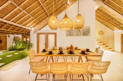 a dining room with a table and chairs at Villa Indigo - 5-BDR with huge pool and garden in Seminyak