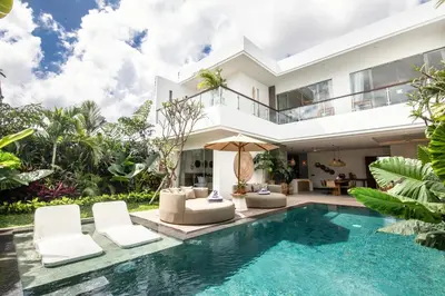 an exterior view of a villa with a swimming pool at Coastal Elegance 4BR Villa, 400m to Finns in Canggu
