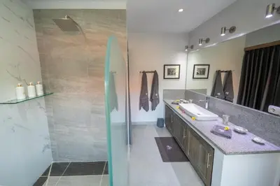 a bathroom with a sink and a mirror at Villa Amana Seminyak in Seminyak