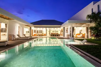 a swimming pool in the backyard of a house at Canggu 400m to Beach Escape 4br Designer villa in Canggu