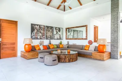 a living room with a couch and a coffee table at Canggu 400m to Beach Escape 4br Designer villa in Canggu