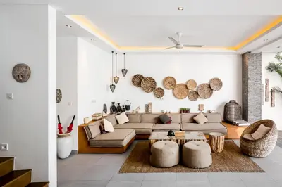a living room with a couch and a table at Villa GoodFellas by BaliSuperHost in Seminyak