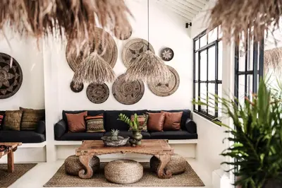 a living room with a couch and a table at Villa Obao in Seminyak