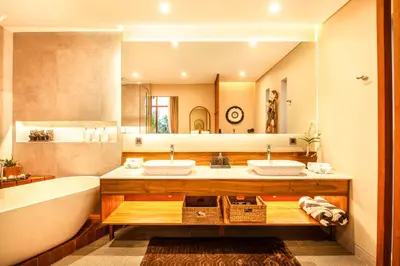 a bathroom with two sinks and a tub and a mirror at Elegant 6BR Villa, Canggu, 400m to Finns Beach in Canggu