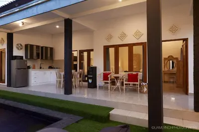 a kitchen and dining area of a house at Villa Ari in Seminyak