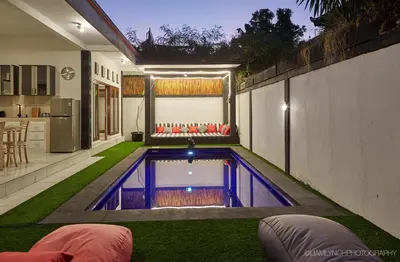 a small swimming pool in the middle of a house at Massive 6-bedroom Villa with 2 Pools in Seminyak