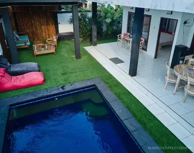 a swimming pool in the yard of a house at Massive 6-bedroom Villa with 2 Pools in Seminyak
