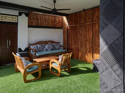 a living room with a table and chairs and a couch at Massive 6-bedroom Villa with 2 Pools in Seminyak