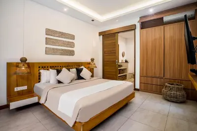 a bedroom with a large bed in a room at Villa Ara by BaliSuperHost in Seminyak