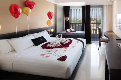 a hotel room with balloons and a bed with a bed sidx sidx sidx at Brits Hotel Legian in Seminyak