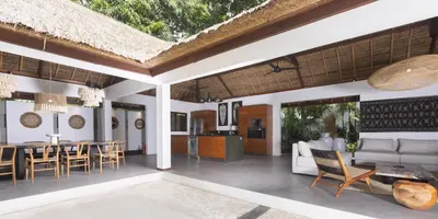 an open living room and dining room with a table and chairs at Large 6-Bedroom Private Villa with Pool for Groups & Families - Umalas in Kerobokan
