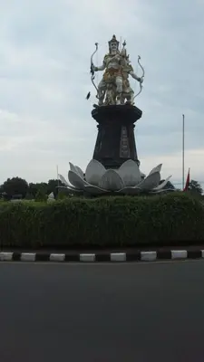 a statue on top of a bunch of flowers at Lavanda guesthouse/homestay in Jimbaran