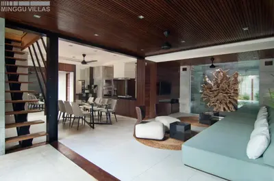 a living room with a couch and a table at 8BR Villa Jumis - Minggu Villas Seminyak in Seminyak
