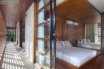 a bedroom with two beds and a large window at 8BR Villa Jumis - Minggu Villas Seminyak in Seminyak