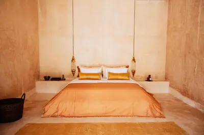 a bedroom with a large bed with two pillows at The Oasis Bali in Canggu