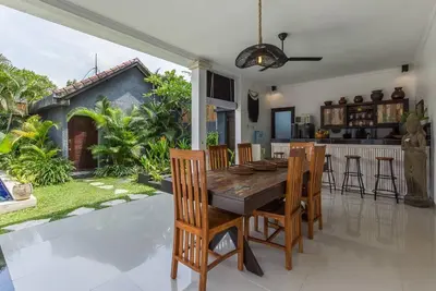 a kitchen and dining room with a table and chairs at Central & Charming 3bedr with private pool in Seminyak