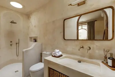 a bathroom with a toilet and a sink and a mirror at NEW Design villa, Casa Alma Bali, 2BR with private pool in Canggu