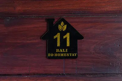 a black house with the number on a wooden drawer at Bali DD homestay seminyak in Seminyak