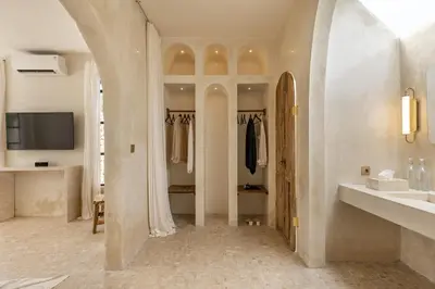 a bathroom with a sink and a mirror at Private Pool Villa Bocami Suites- 1 by OriVista in Kerobokan