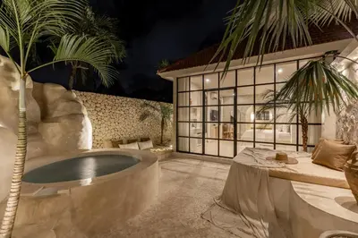 a bathroom with a large tub in a yard at Private Pool Villa Bocami Suites- 1 by OriVista in Kerobokan