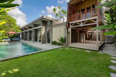 an exterior view of a house with a swimming pool at Villa Deh Simba at Seminyak Aramanis in Seminyak
