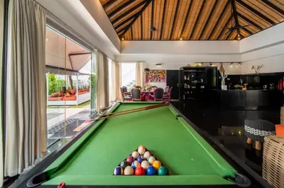 a billiard room with a pool table at Villa Kalamansi Seminyak in Seminyak