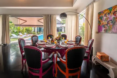 a dining room with a table and chairs at Villa Kalamansi Seminyak in Seminyak