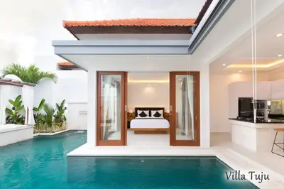 a villa with a swimming pool and a bedroom at Villa Mia Seminyak - Boutique Villas - II in Seminyak