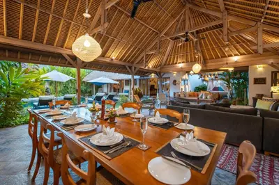 a dining room with a long table in a villa at Gorgeous Balinese Designed 3 Bed Villa, Top Pick! in Seminyak