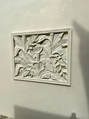 a framed picture of a mural of leaves on a wall at 5 Bedroom Getaway Villa - Kuta Regency B3 in Kuta
