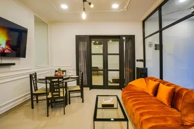 a living room with a couch and a table at Villa Canberra - Seminyak in Seminyak
