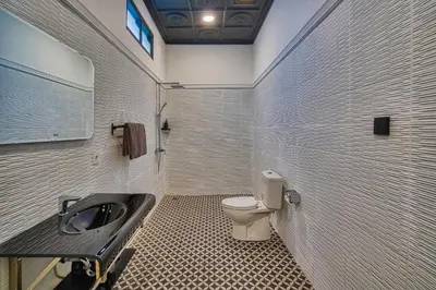 a bathroom with a toilet and a sink at Villa Canberra - Seminyak in Seminyak