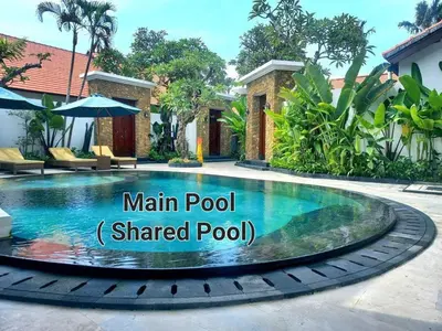 a small pool with a shaded pool at Alam Jepun Villa in Legian