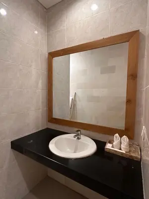 a bathroom with a sink and a mirror at NEW Villa Indah Seminyak 3BR Private Pool in Seminyak