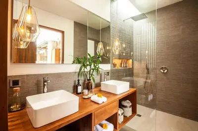 a bathroom with a sink and a shower at Luxury 5bd Villa 5 Min From Berawa Beach in Canggu