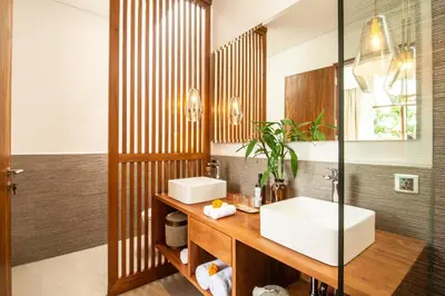 a bathroom with a sink and a mirror at Luxury 5bd Villa 5 Min From Berawa Beach in Canggu