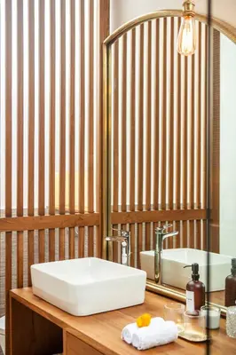 a bathroom with a sink and a mirror at Luxury 5bd Villa 5 Min From Berawa Beach in Canggu