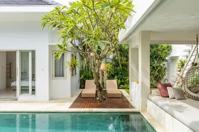a living room with a pool and a villa at Fresh and Stylish 3bd Villa in Seminyak with Private Pool in Seminyak