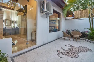 a house with a snake painted on the side of it at Villa Bulan Batubelig in Canggu