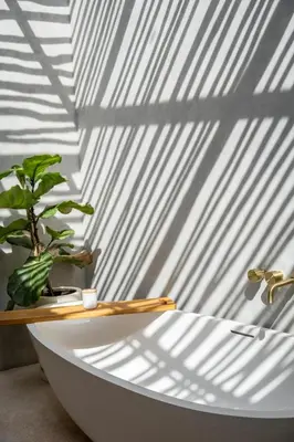 a white bath tub with a potted plant on it at Rumah Ananda Bali - Balinese Villa Umalas in Canggu