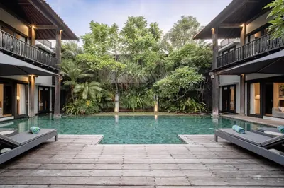 a swimming pool in the middle of a house at Villa De Suma - Fully Staffed Luxury Villa, Central Seminyak, walk to the beach in Seminyak