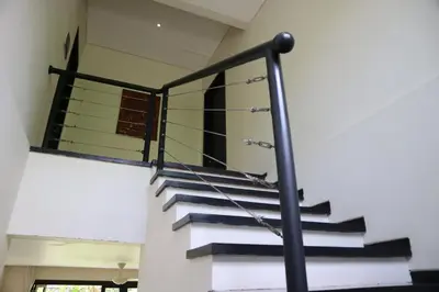 a glass staircase in a house at Villa Mertasari 10C 4 Bedroom with Swimming pool! in Sanur