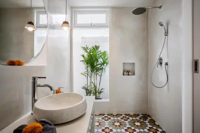 a bathroom with a sink and a mirror and a shower at Villa Cyma by Alfred in Bali in Seminyak