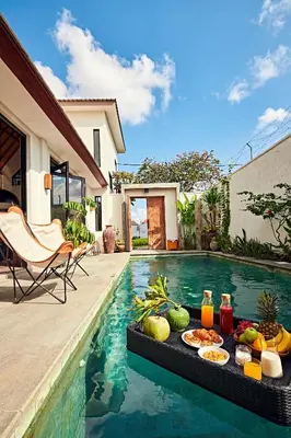 a buffet of food on a table next to a swimming pool at MASARA Villa - 5Min to Canggu - 2Min to Shops & Restaurants in Canggu